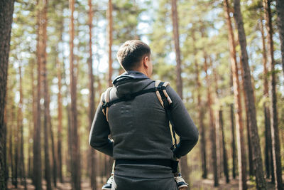 Rear view of man in forest