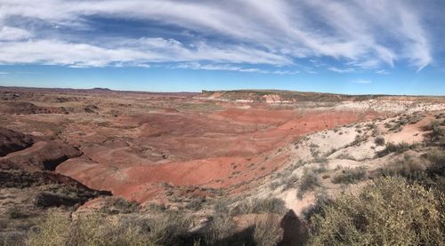 View of desert against cloudy sky