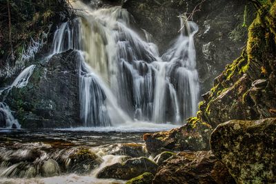 Scenic view of waterfall in forest