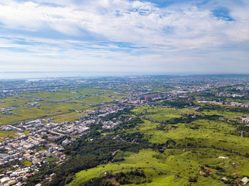 Aerial view of city against sky