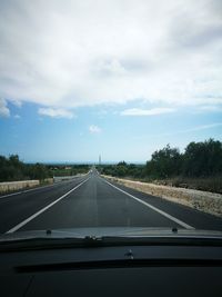 Highway seen through car windshield