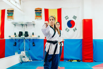 Young woman practicing martial arts