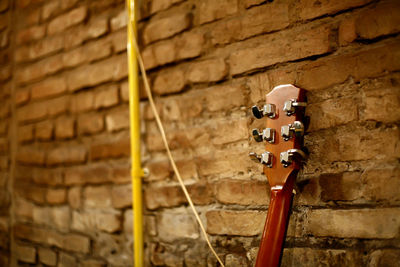 Close-up of wall with guitar