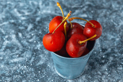 Close-up of wet red berries on water