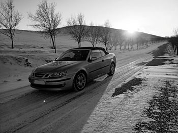 Cars on road against sky