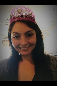 Portrait of smiling young woman standing at home