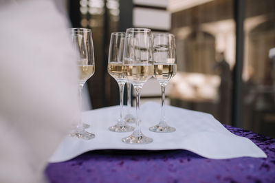 Close-up of wineglasses on table