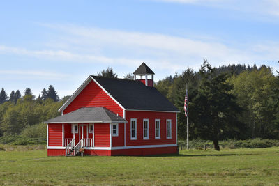 House on field against sky