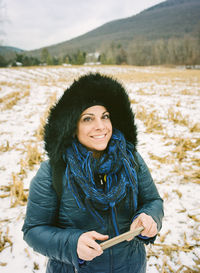 Smiling woman standing on field