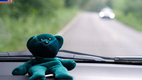 Close-up of stuffed toy in car