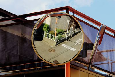 High angle view of staircase by swimming pool against sky