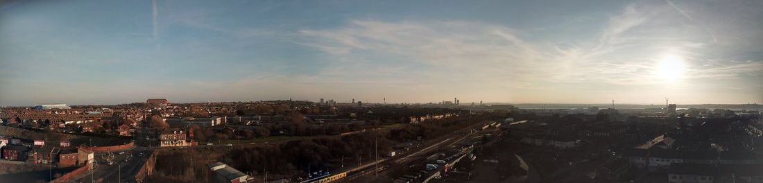 High angle shot of townscape against sky at sunset