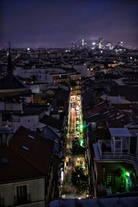 High angle view of illuminated city buildings at night