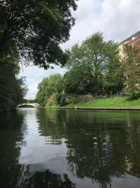 Reflection of trees in lake against sky