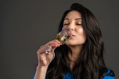 Portrait of a woman drinking glass