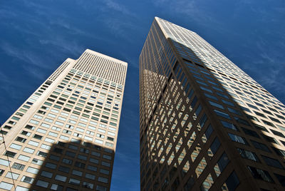 Low angle view of skyscrapers against sky