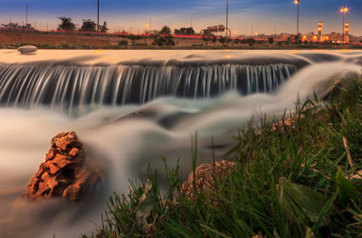 View of river flowing through landscape