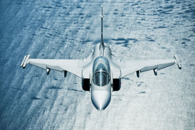 Airplane flying against blue sky