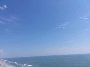 Scenic view of sea against blue sky