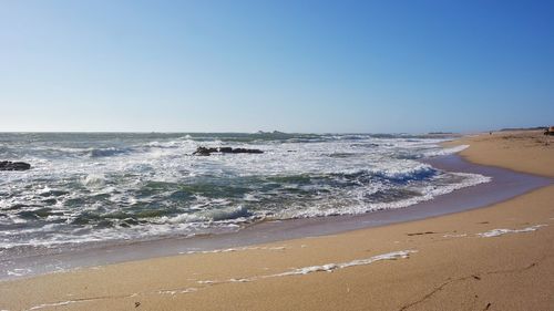 Scenic view of sea against clear sky