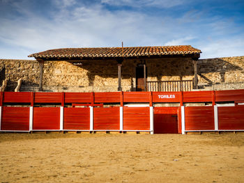 Built structure on beach against sky