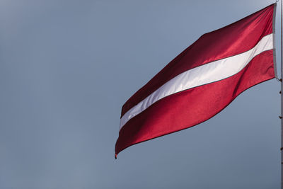 Low angle view of flag against clear sky