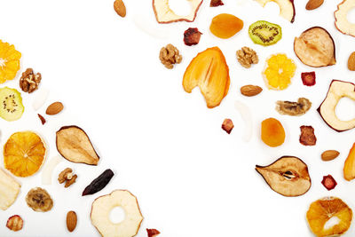 High angle view of candies against white background