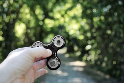 Close-up of hand holding eyeglasses