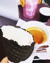 Close-up of ice cream served on table