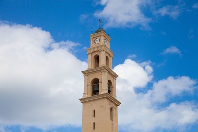 Low angle view of bell tower against sky