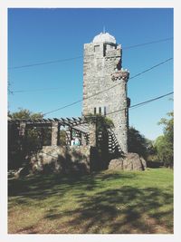 Low angle view of fort against blue sky