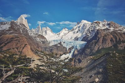 Scenic view of snowcapped mountains against sky