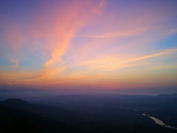 Scenic view of mountains against sky during sunset
