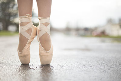 Low section of ballet dancer outdoors