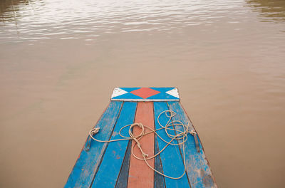 High angle view of ropes on boat over lake