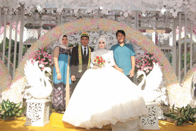 Couple kissing outside temple