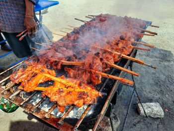 High angle view of meat on barbecue grill