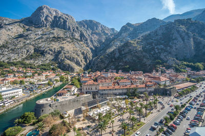 High angle view of townscape and mountains against sky
