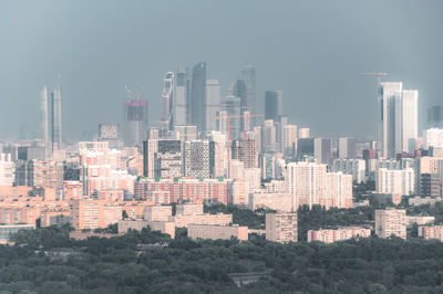 Modern buildings in city against sky