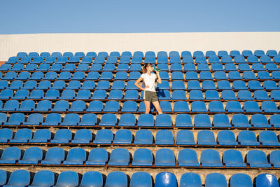 Healthy lifestyle concept. teenage doing sports alone at the empty stadium