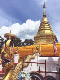 Statue of pagoda against sky