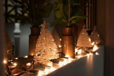Close-up of illuminated christmas tree at home