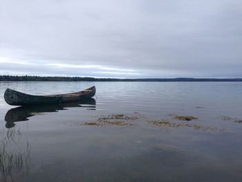 Boats in calm lake