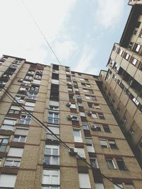 Low angle view of office building against sky