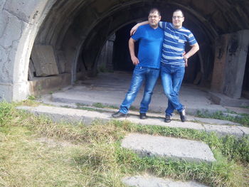 Full length portrait of a couple standing outdoors