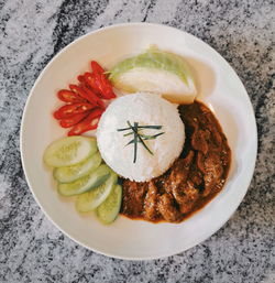 High angle view of fruit in plate on table