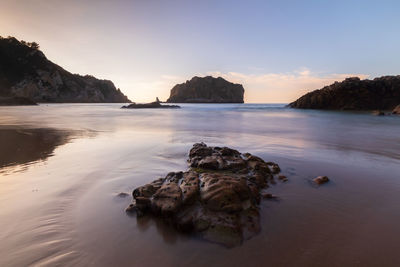 Scenic view of sea against clear sky during sunset