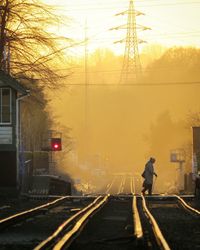 View of railroad tracks at sunset