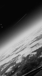 Aerial view of snowcapped mountain against sky