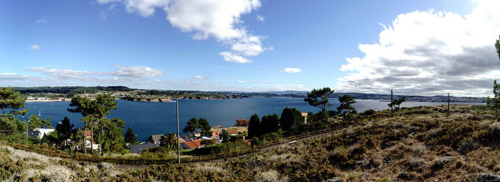 High angle view of trees by sea against sky